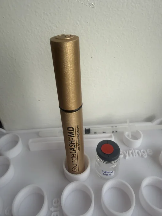 GrandeLASH-MD tube beside its labeled test sample for The Lash List comparison
