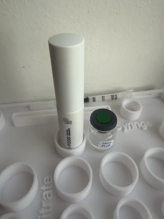 LashFood Phyto-Medic tube beside its labeled test sample for The Lash List comparison