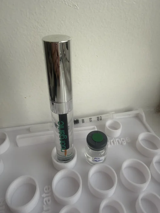 NuOrganic Cosmic Lash tube beside its labeled test sample for The Lash List comparison