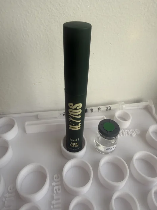 SOWN Root 1 tube beside its labeled test sample for The Lash List comparison