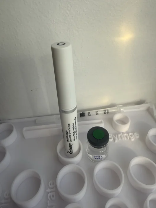 The Ordinary Multi-Peptide tube beside its labeled test sample for The Lash List comparison